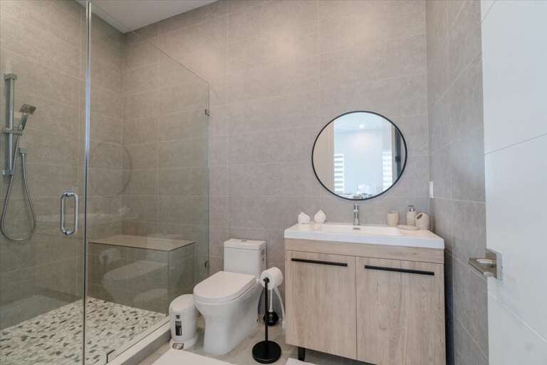 3rd level king bedroom`s ensuite bathroom with walk-in shower.